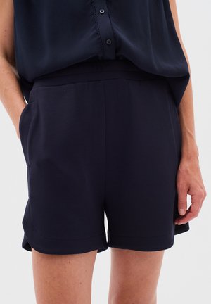 Șorturi de culoare bleu marin dintr-un material neted, având buzunare laterale, talie elastică și o croială lejeră.