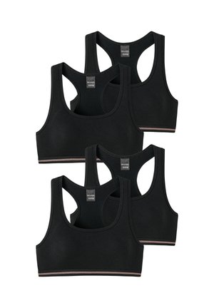 Four black ribbed sports bras with racerback design and small tags at the neckline shown from front against white background.