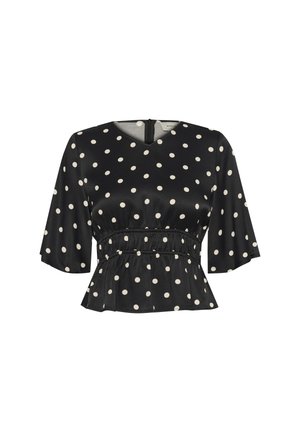 Black, short-sleeve blouse featuring a polka dot pattern in cream, with a fitted waist and peplum hem, and a back zipper closure.