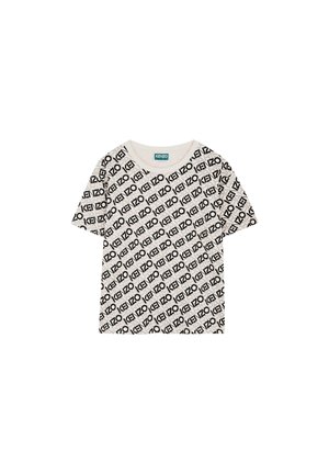 Short-sleeve, crew neck t-shirt in light beige with a repeating black printed logo pattern. Soft cotton material with relaxed fit.