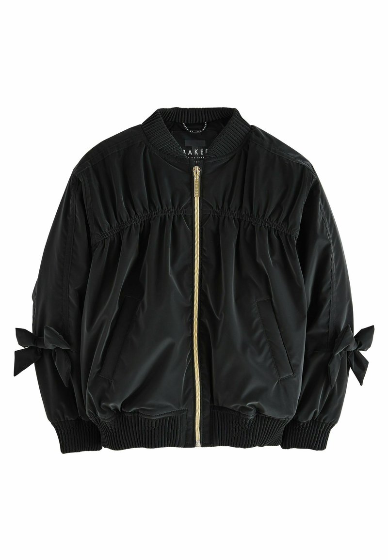 Giacca bomber nera con zip frontale, vita e maniche elasticizzate con fiocchi. Realizzata in tessuto nylon liscio e lucido.