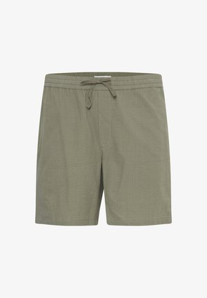 Oliivinvihreät uimapuvut, jotka on valmistettu teksturoidusta kankaasta. Niissä on joustava vyötärö, jossa on kiristysnauha sekä sivutaskut.