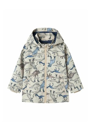 Chaqueta impermeable para niños en color beige con estampado de dinosaurio. Cuenta con capucha, cremallera frontal y dos bolsillos. Tejido texturizado con detalles en azul y marrón.