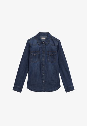 Tummansininen farkkutakki, jossa on terävä kaulus, edessä nappisuljenta ja kaksi rintataskua. Ominaisuuksiin kuuluu pitkät hihat ja kaareva helma.