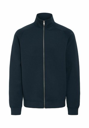 Marinblå zip-up sweatshirt med hög krage, ribbade ärmmuddar och fåll, tillverkad av mjukt, strukturerat tyg. Har en framzippering.