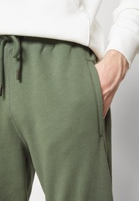 The North Face Träningsbyxor - dark green