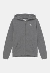 Hoodie zippé gris en tissu doux, avec deux poches avant et un petit logo de moose blanc sur la poitrine gauche.