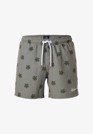 Zielone i białe kąpielówki w paski z czarnymi wzorami żółwi, białym sznurkiem i wyhaftowanym logo marki na obszyciu.