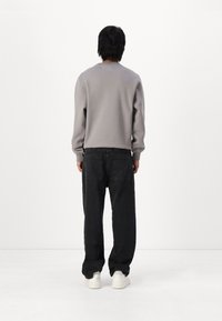 Hollister Co. Vrečaste kavbojke - washed black