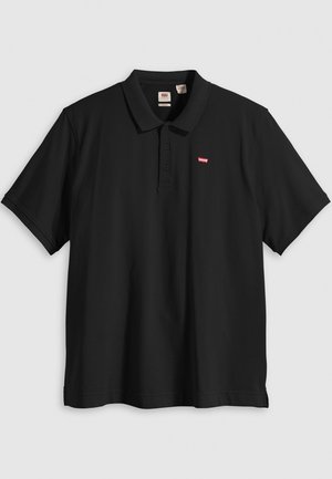 Polo preto com gola clássica, mangas curtas e um pequeno logotipo vermelho no lado esquerdo do peito. Feito de um tecido suave com um design simples.