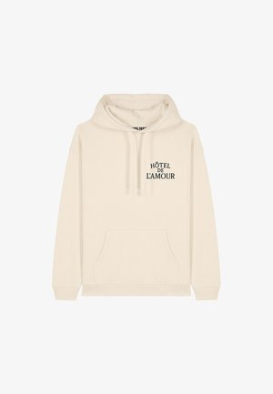 Felpa crema realizzata in morbido tessuto, con tasca a marsupio frontale e testo nero "HÔTEL DE L’AMOUR" sul petto.