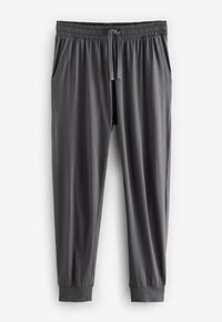 Sötétszürke, szűkített szabású sportnadrág elasztikus derékpánttal, húzózsinórral, oldalzsebekkel és mandzsettás szárvégekkel, fehér háttéren lefektetve.