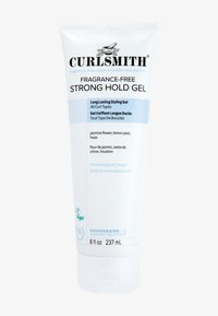 Gel per capelli a forte tenuta senza profumo di Curlsmith in un tubetto bianco da 237 mL. Presenta testo blu, etichetta testata dermatologicamente e simbolo vegano.