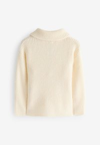 Pull en tricot côtelé de couleur crème avec un col montant et des manches longues, présentant un motif texturé et une coupe décontractée.