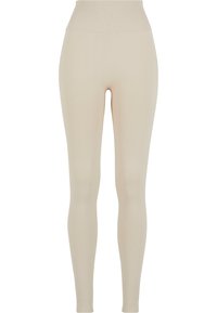 Leggings beige realizzati in tessuto elasticizzato con vita alta; texture liscia, silhouette aderente, senza motivi visibili o dettagli hardware.