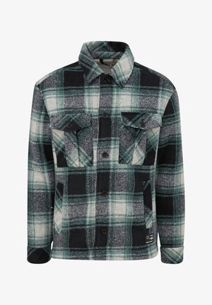 Zielono-czarna flanelowa kurtka w kratę z kołnierzykiem, dwiema kieszeniami na piersi, zapięciem na guziki z przodu oraz fakturowanym materiałem. Posiada ciemne guziki i metkę na dolnym brzegu.