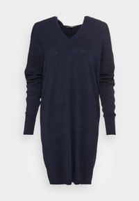 Robe-pull bleu marine à manches longues avec col en V, poignets côtelés et coupe ample. Texture douce avec un design simple et épuré.