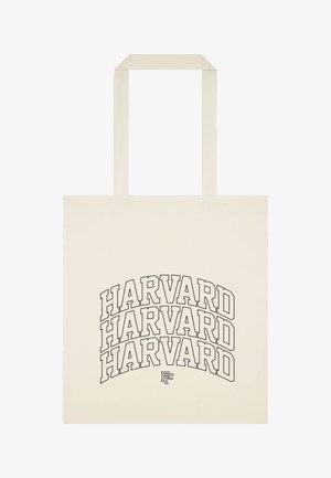 Beżowa torba na ramię z trzema ułożonymi jedna na drugiej czarnymi napisami "HARVARD" z konturem i małym nakładającym się logo "PF" pod tekstem.