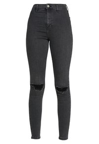 Svarta, högmidjade tajta jeans med trasiga hål på båda knäna, framknäppning och blixtlåsstängning.