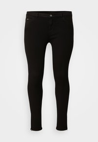 Black skinny jeans in stretch denim. Features a front button closure, two front pockets, and zippers at the ankle hems. Smooth texture.