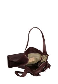 Leren handtas in bordeauxrood, met een gestructureerd oppervlak, dubbele handvatten en een ruime binnenkant met een ritsvak en een beige voering.