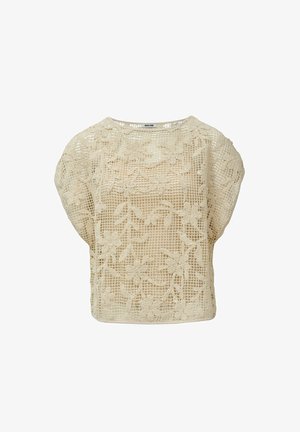Haut en dentelle beige avec un motif floral. Coupe ample, encolure ronde, manches courtes et surface texturée. Matière légère et respirante.