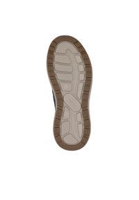 Semelle de chaussure avec un design en caoutchouc, des motifs de traction beige et un contour marron. Texture lisse avec des rainures moulées pour une meilleure adhérence.