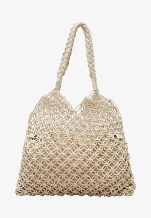 Bolso tote grande de macramé beige con asas trenzadas y patrón de nudos circulares sobre un forro de tela.