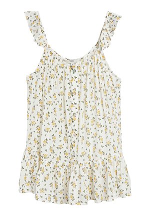 Chemisier blanc sans manches avec imprimé floral jaune, boutonné à l'avant, bretelles à volants et ourlet évasé.