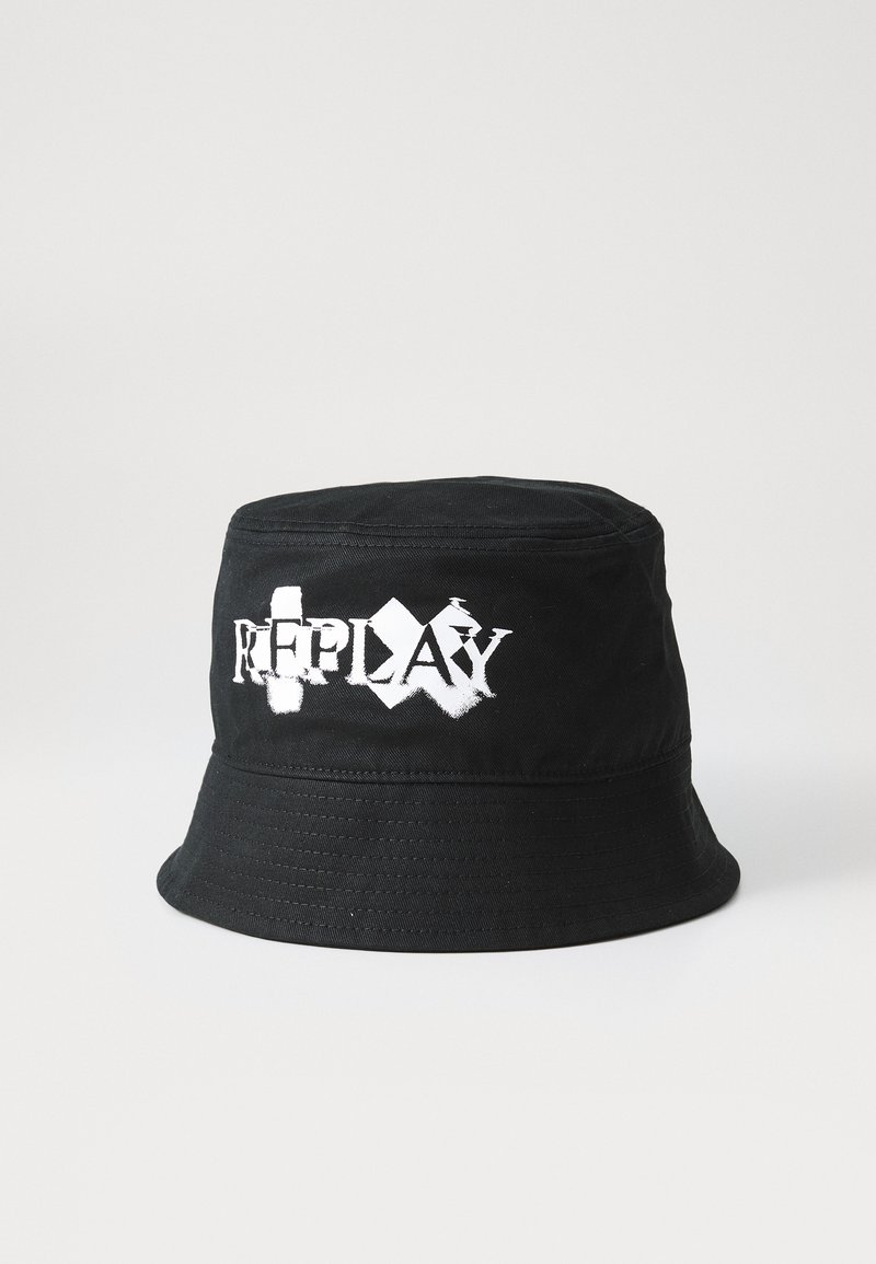 Black bucket hat made of fabric, featuring a white logo "REPLAY" with distressed lettering. Smooth texture, wide brim, and stitched detailing.