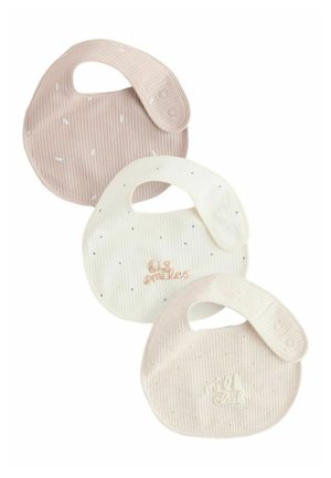 Three ribbed fabric baby bibs in beige, off-white, and cream with snap closures, two embroidered with "big smiles" and "milk club."