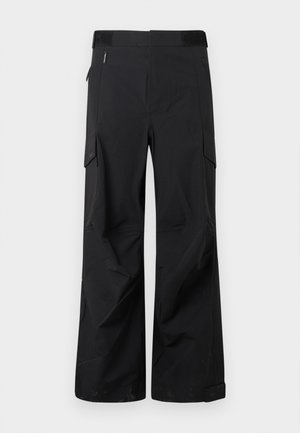 Black cargo pants made from a smooth, water-resistant fabric. Features wide legs, multiple side pockets, and a flat waistband with subtle branding.