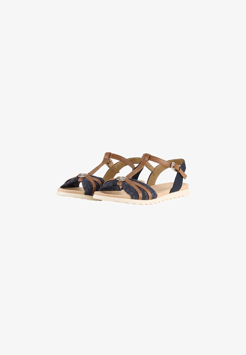 Brown and navy sandals with crisscross straps, featuring a textured upper and a flat beige sole. Decorative buckle accent on the strap.