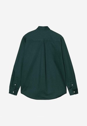 Camisa de manga larga color verde oscuro hecha de algodón. Presenta un cuello con botones, puños abotonados y un dobladillo curvado con un pliegue central en la parte trasera.
