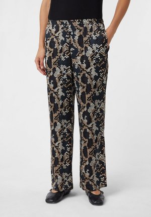 Schwarz, beige und weiße gemusterte Pants mit Schlangenprint-Design, elastischem Bund und weitem Bein. Weicher, strukturierten Stoff.