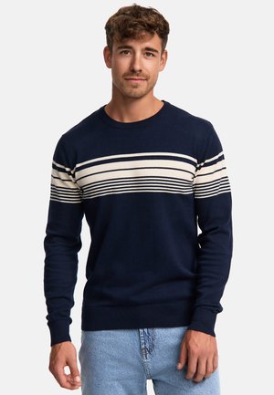 Mørkeblå sweater med horisontale cremefarvede og mørkeblå striber over brystet, rund halsudskæring og ribbede manchetter. Blød strikstruktur.