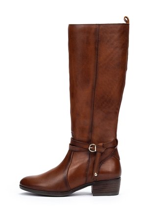 Brown leather knee-high boot with a rounded toe, side buckle accent, and chunky heel. Textured surface and a decorative strap detail.