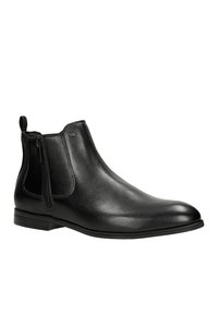 Schwarze Leder-Ankle-Boots mit glatter Oberfläche, seitlichen Reißverschlüssen und einem niedrigen Blockabsatz. Minimalistisches Design mit dezentem Branding.