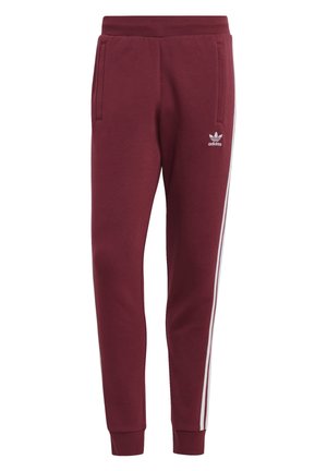 Vinrøde Adidas løbebukser med hvide sideløbende striber, elastisk taljebånd, ankelmanchetter og forlommer, med Adidas-logo på låret.