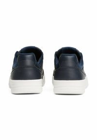 Navy leather sneakers with a smooth finish, white rubber sole, low-top design, and mesh accents at the side for ventilation.