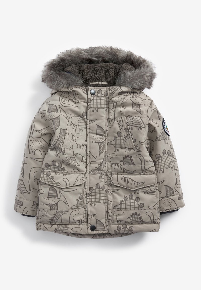 Veste d'hiver beige pour enfants avec imprimés de dinosaures, poches avant, boutons-pression et capuche doublée de fausse fourrure grise.