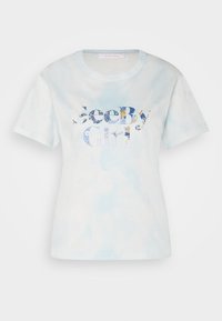 Ljusblå tie-dye kortärmad T-shirt med mönstrad "See By Chloé"-text på framsidan och rund halsringning.