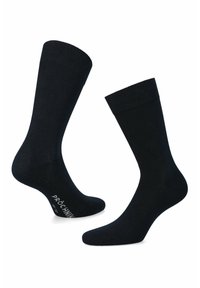 Czarne bawełniane skarpetki z ściągaczem, cechujące się gładką fakturą i logo na pięcie. Standardowa długość do kostki dla wygody.