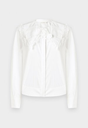 Witte blouse met lange mouwen en grote puntige kantenkraag, voorzien van bloemengestikte details en onzichtbare knopen aan de voorkant.