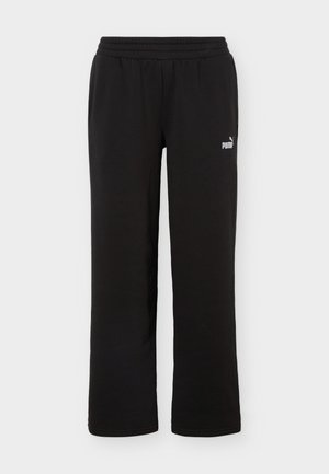 Černé tepláky se širokými nohavicemi, elastickým pasem a malým bílým logem Puma na pravém stehně.