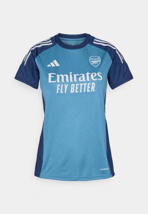 Turquoise and navy blue soccer jersey with short sleeves, featuring white "Emirates" logo, "FLY BETTER" text, and Adidas stripes.