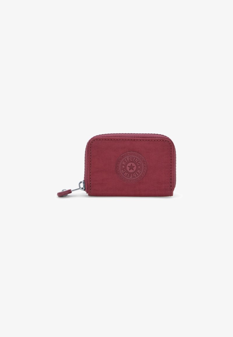 Red wallet made of textured fabric, with a rounded shape and zip closure. Features embossed logo and a pull tab for easy access.