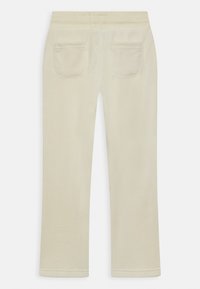 Calças creme com um design de perna reta, apresentando dois bolsos traseiros e uma cintura elástica para conforto. Textura suave e estilo simples.