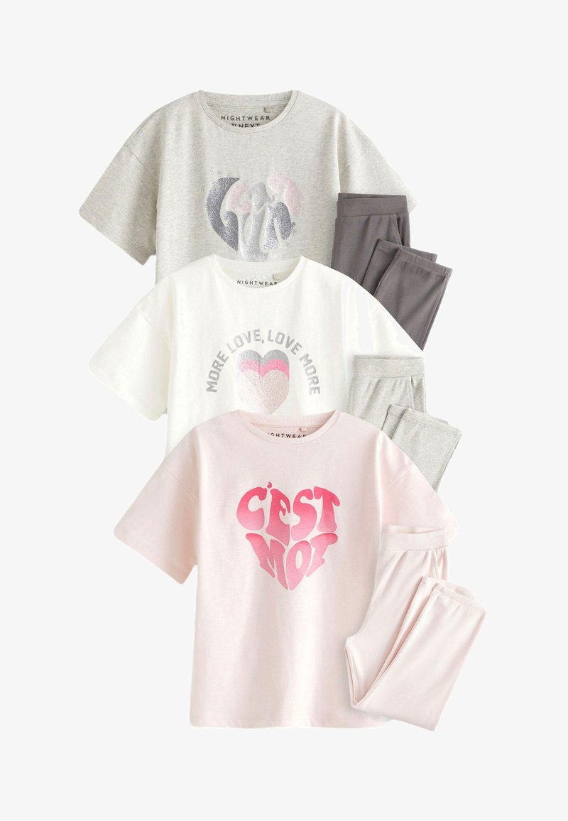 Three sets of nightwear: grey T-shirt with glitter design, white T-shirt with silver text, and pink T-shirt with heart graphic; soft material.