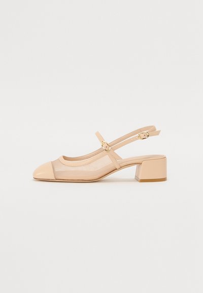 Nude slingback shoe with a transparent mesh upper, rounded toe, and a block heel. Includes a delicate strap with gold-toned hardware accents.